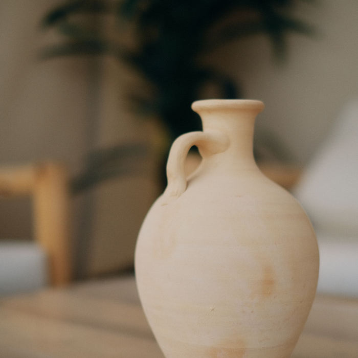 A clay jug in a loose boho style, handmade in character.