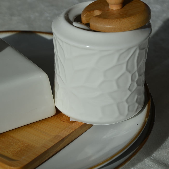 A ceramic jar with a wooden lid, made for storage about the house and kitchen.