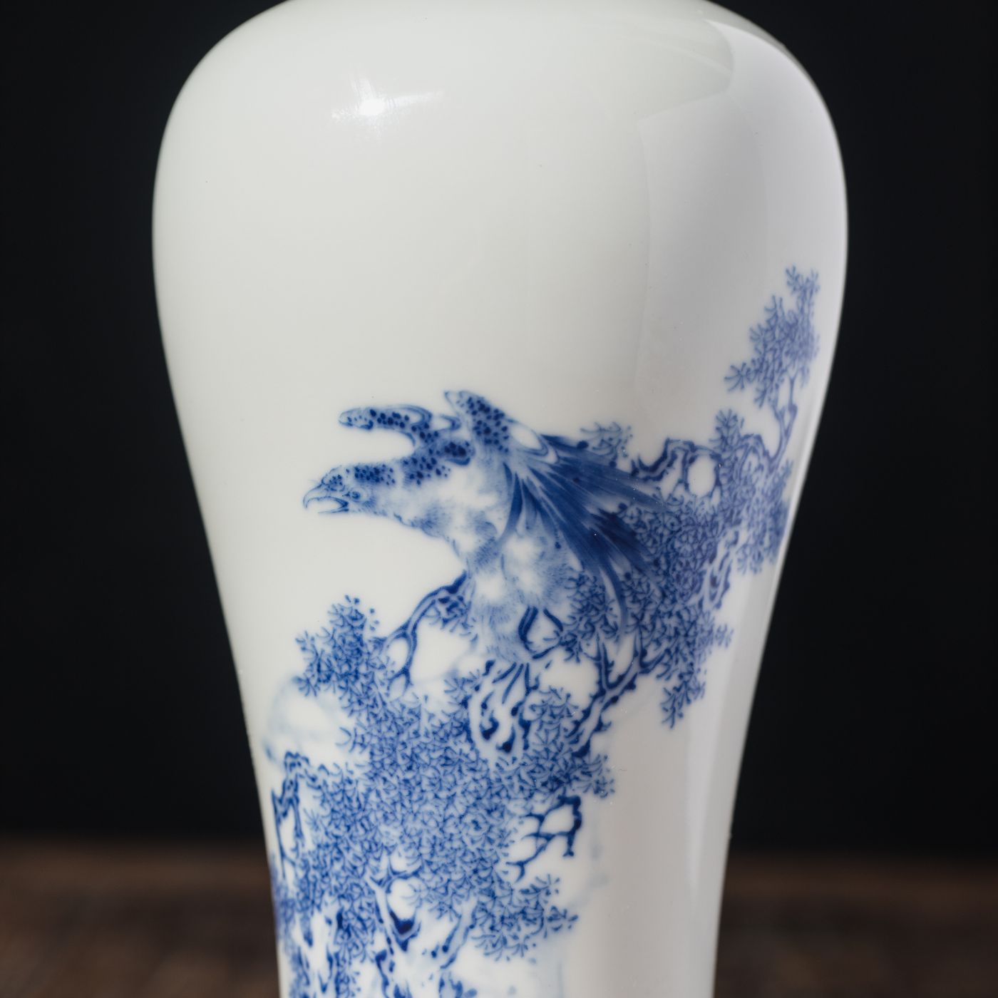 A Chinese porcelain vase covered in intricate blue artwork.